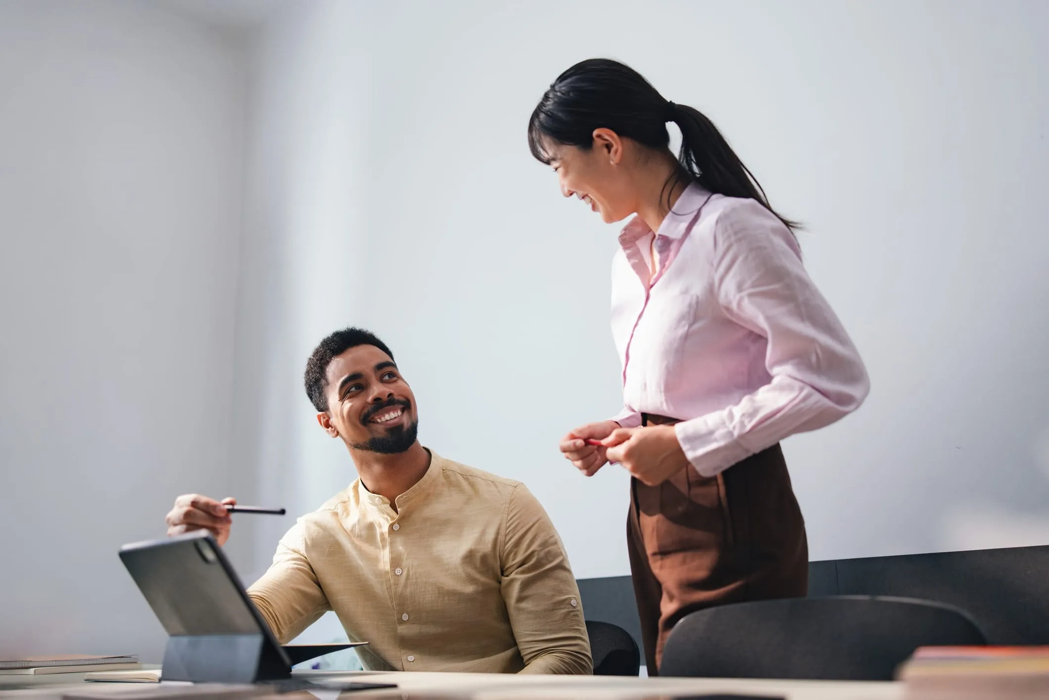 Two accounting professionals collaborating in a modern office