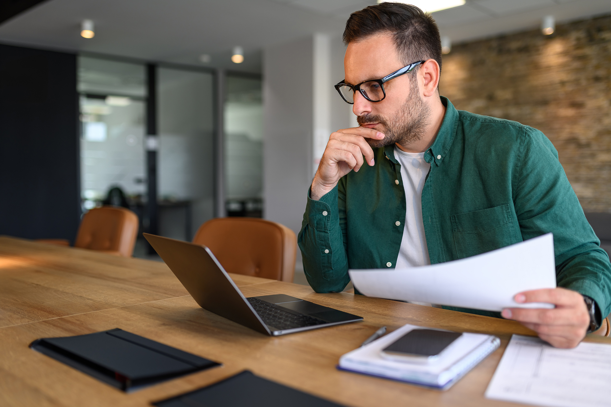 3 Signs Your Tax & Accounting Firm Needs a Digital Marketing Facelift | Tax advisor contemplating his digital marketing plans
